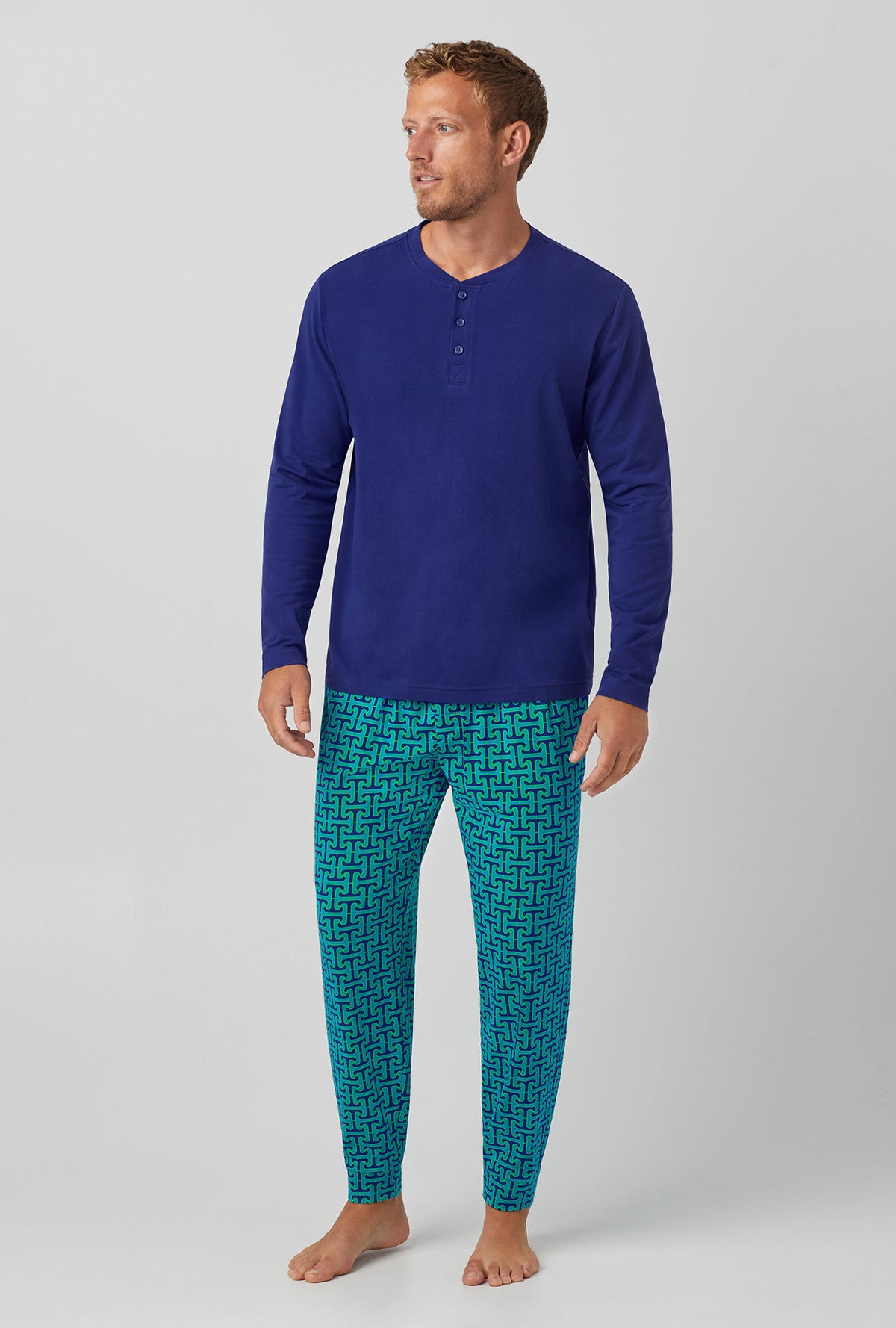 A man wearing blue  Jogger Stretch Jersey PJ Set with Tile Mens Henle print