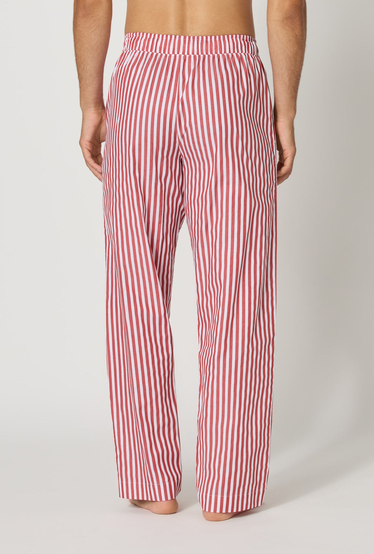 A man wearing Red Signature Stripe Men's Woven Cotton Sateen Pj Pant back view