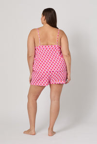 A lady wearing plus size BedHead x Trina Turk Scallop Cami Shorty Stretch Jersey Pj Set