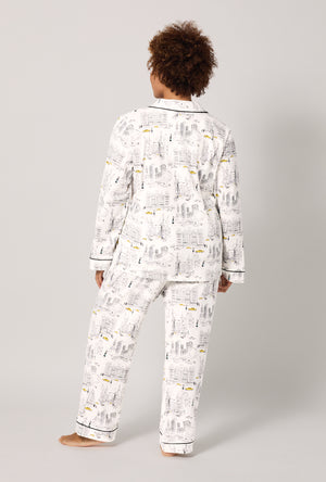A lady wearing a plus size City That Never Sleeps Long Sleeve Classic Stretch Jersey PJ Set