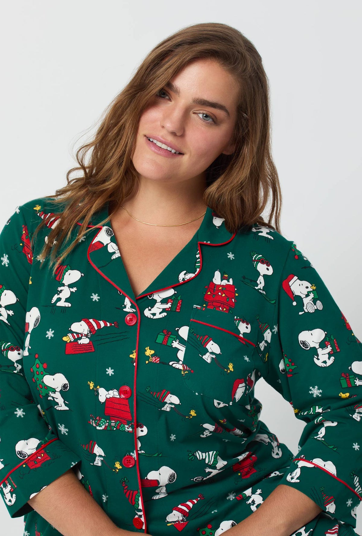 A lady wearing ®Snoopy's Holiday Fun 3/4 Sleeve Classic Stretch Jersey Cropped Pj Set