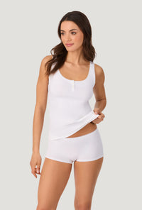 A lady wearing White Stretch Jersey Tank looking side