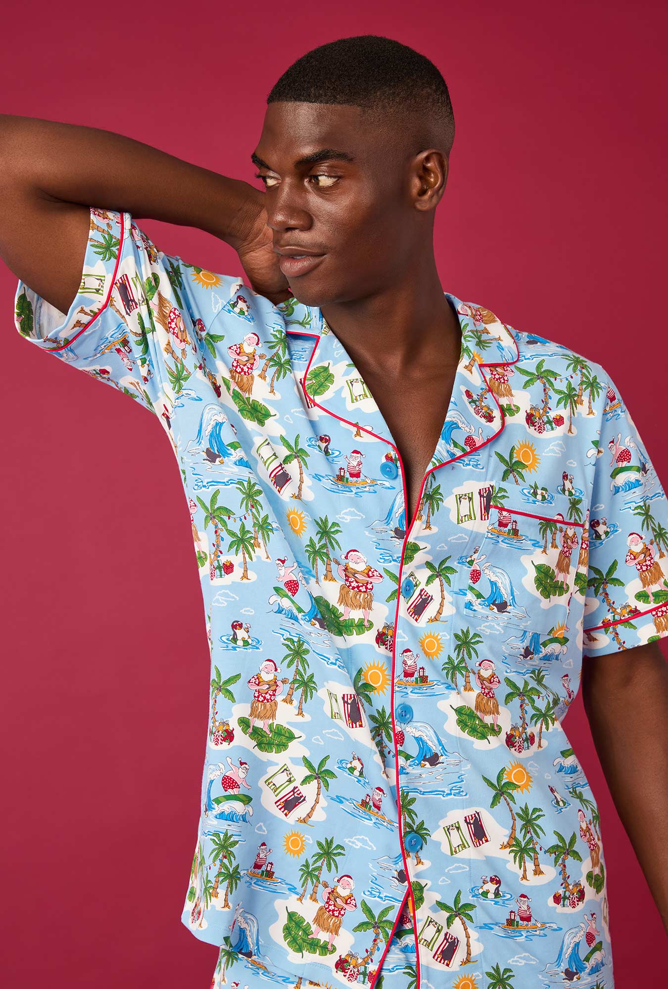 A man wearing Surfin' Santa Men's Short Sleeve Classic Stretch Jersey Short Pj Set