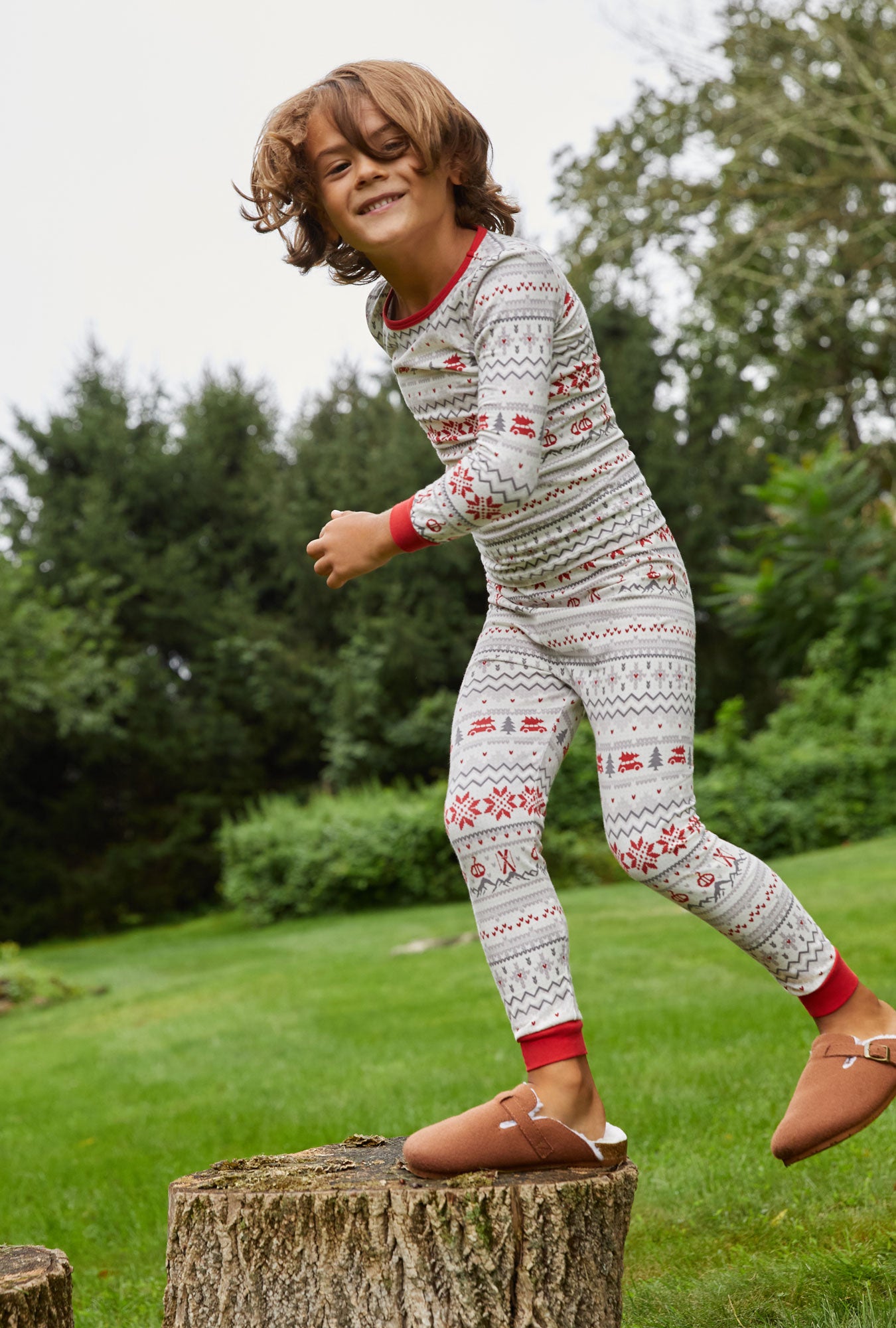 A kid wearing white Long Sleeve Stretch Jersey Kids PJ Set with Alpine Fair print