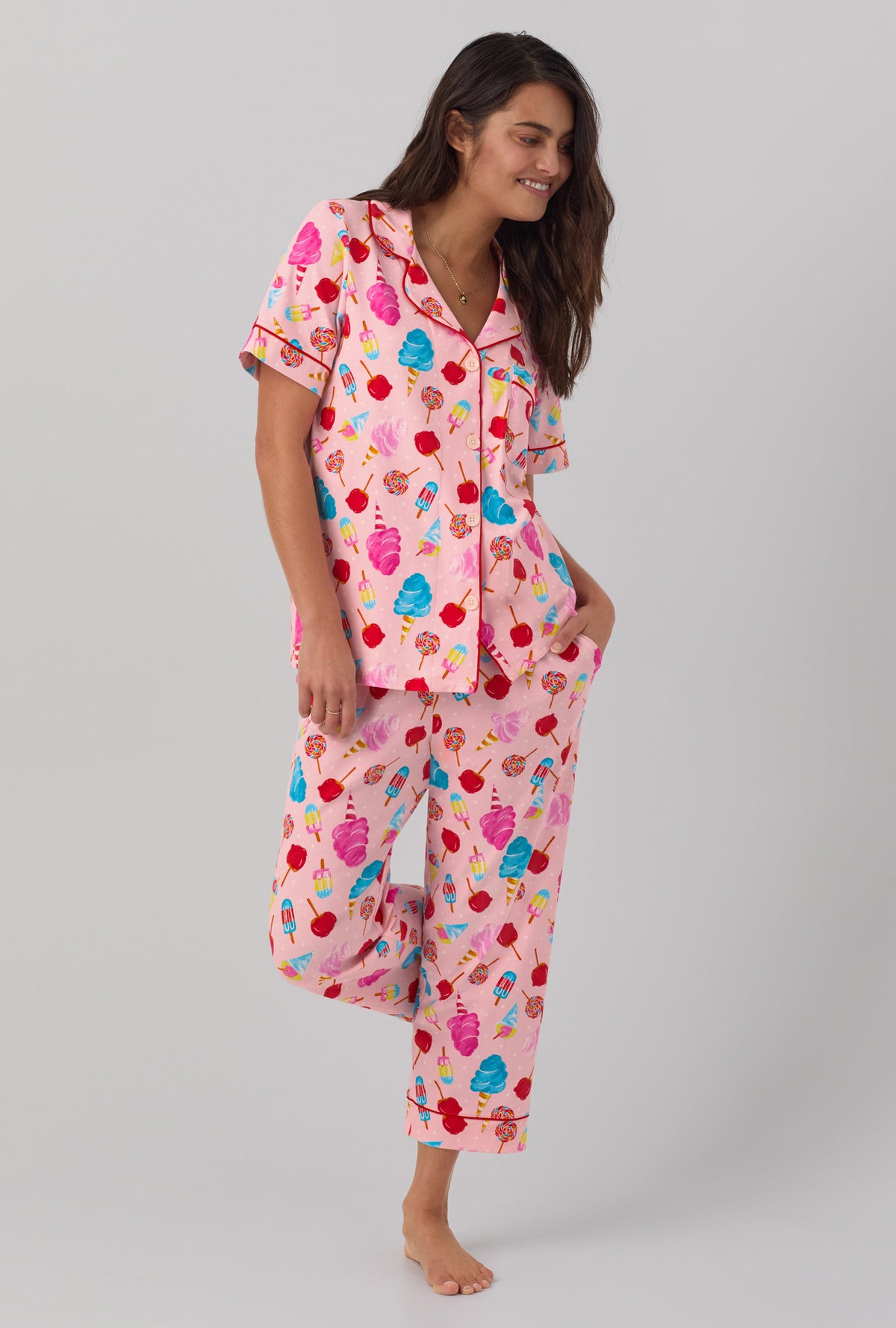 A lady wearing Short Sleeve Classic Stretch Jersey Cropped PJ Set with sweet treats print