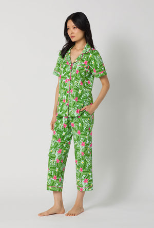 A Lady Wearing Monstera Bloom Short Sleeve Classic Stretch Jersey Cropped Pj Set posing in a side angle look