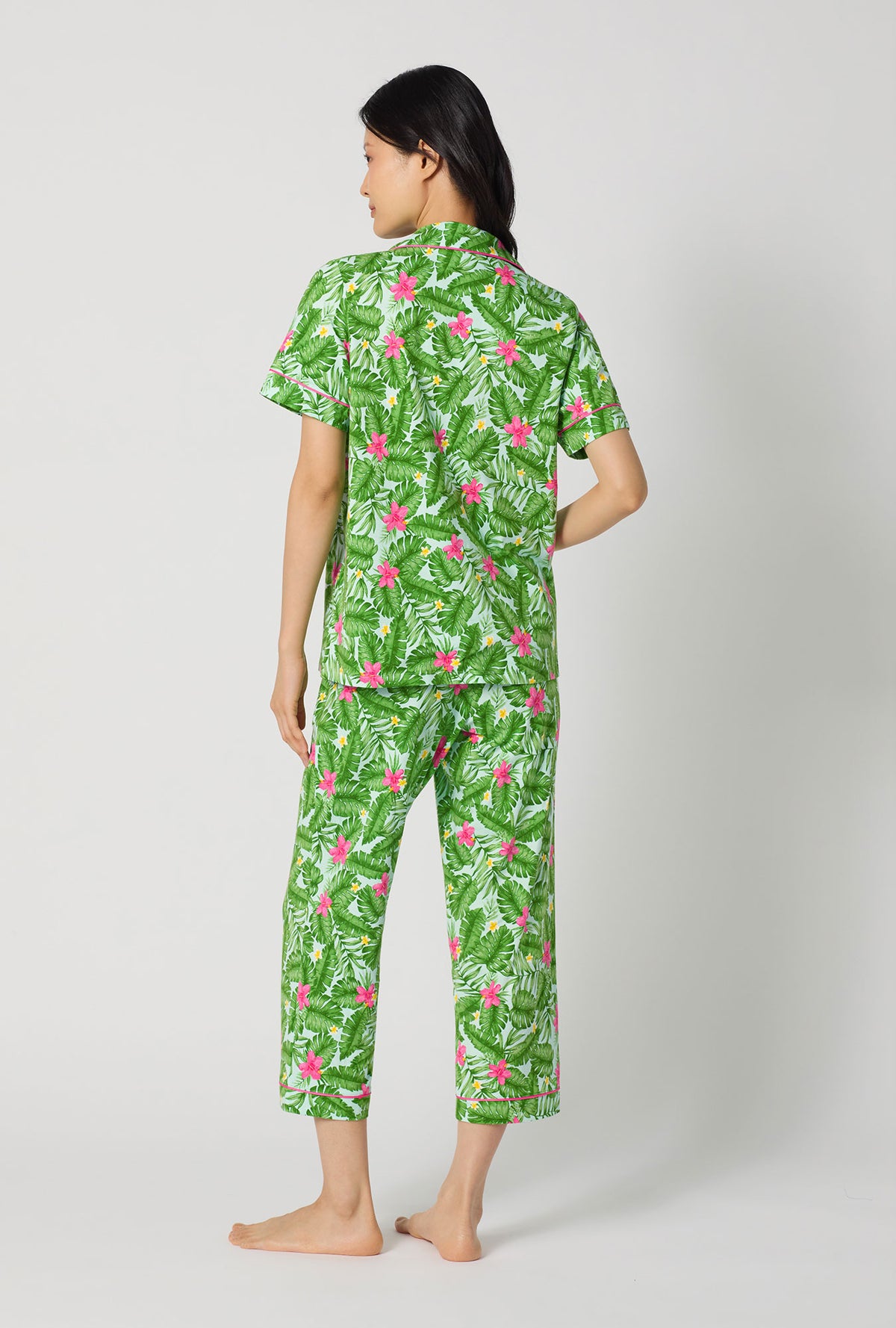 A Lady Wearing Monstera Bloom Short Sleeve Classic Stretch Jersey Cropped Pj Set showing the back view