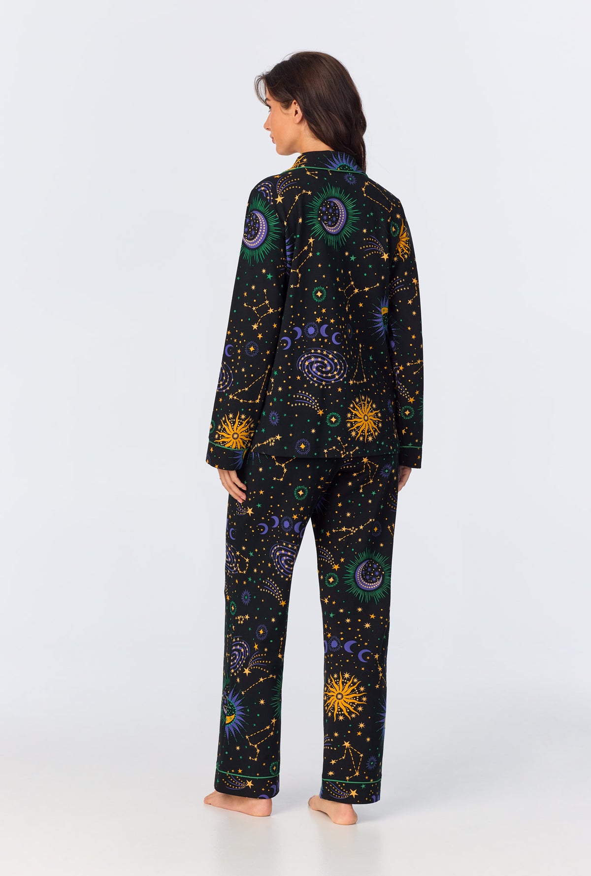 A lady wearing long sleeve classic stretch jersey long pj set with night sky print