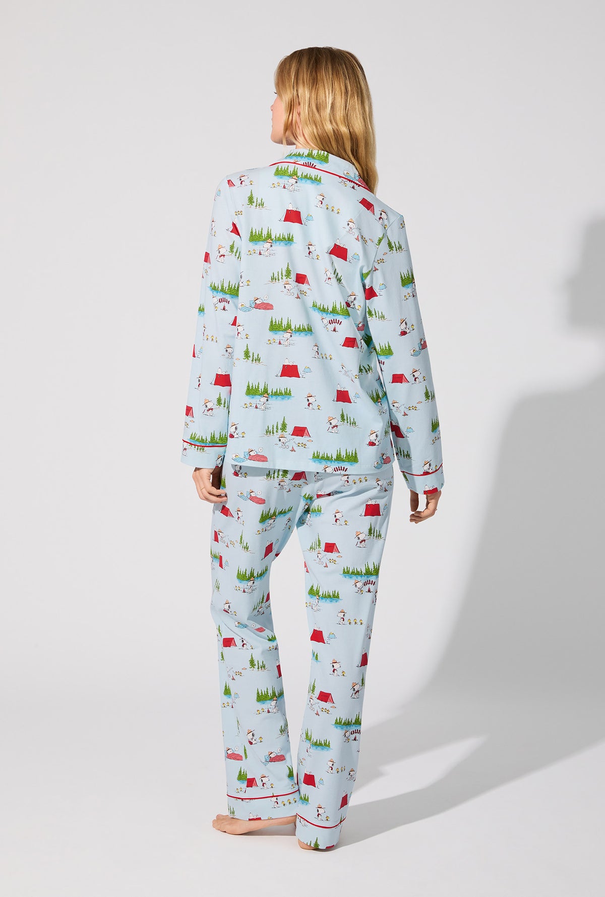 A lady wearing Peanuts® Camp Snoopy Long Sleeve Classic Stretch Jersey PJ Set
