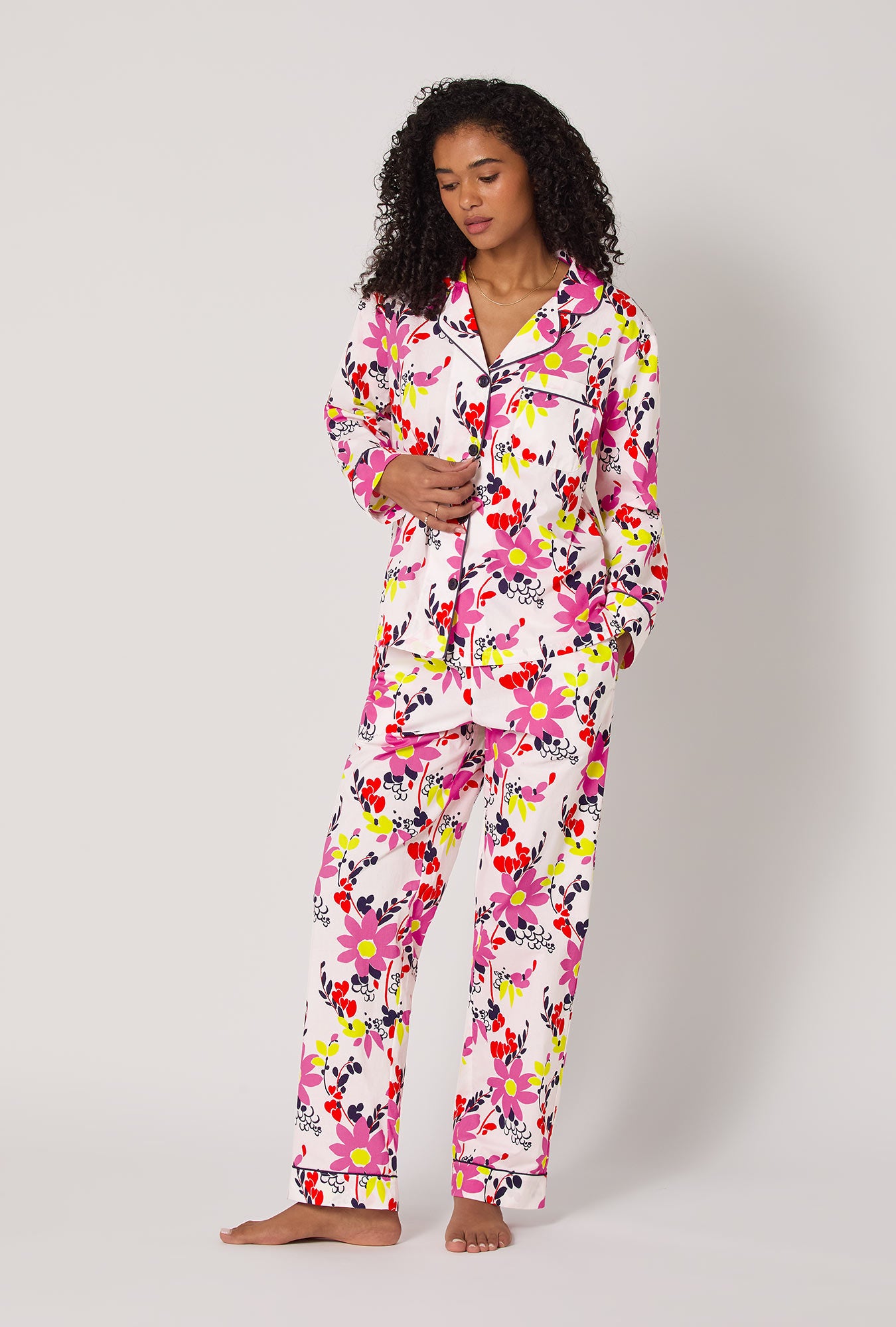 A lady wearing BedHead x Trina Turk Whimsical Floral Long Sleeve Classic Woven Cotton Poplin Pj Set