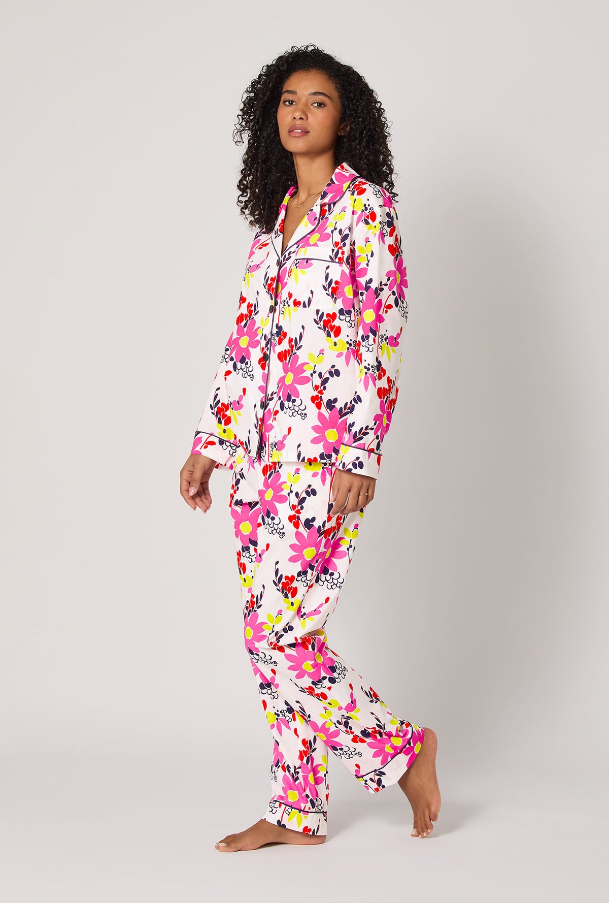 A lady wearing BedHead x Trina Turk Whimsical Floral Long Sleeve Classic Woven Cotton Poplin Pj Set