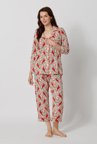 A lady wearing Rifle Paper Co. x BedHead PJs Cardinals 3/4 Sleeve Classic Stretch Jersey Cropped Pj Set