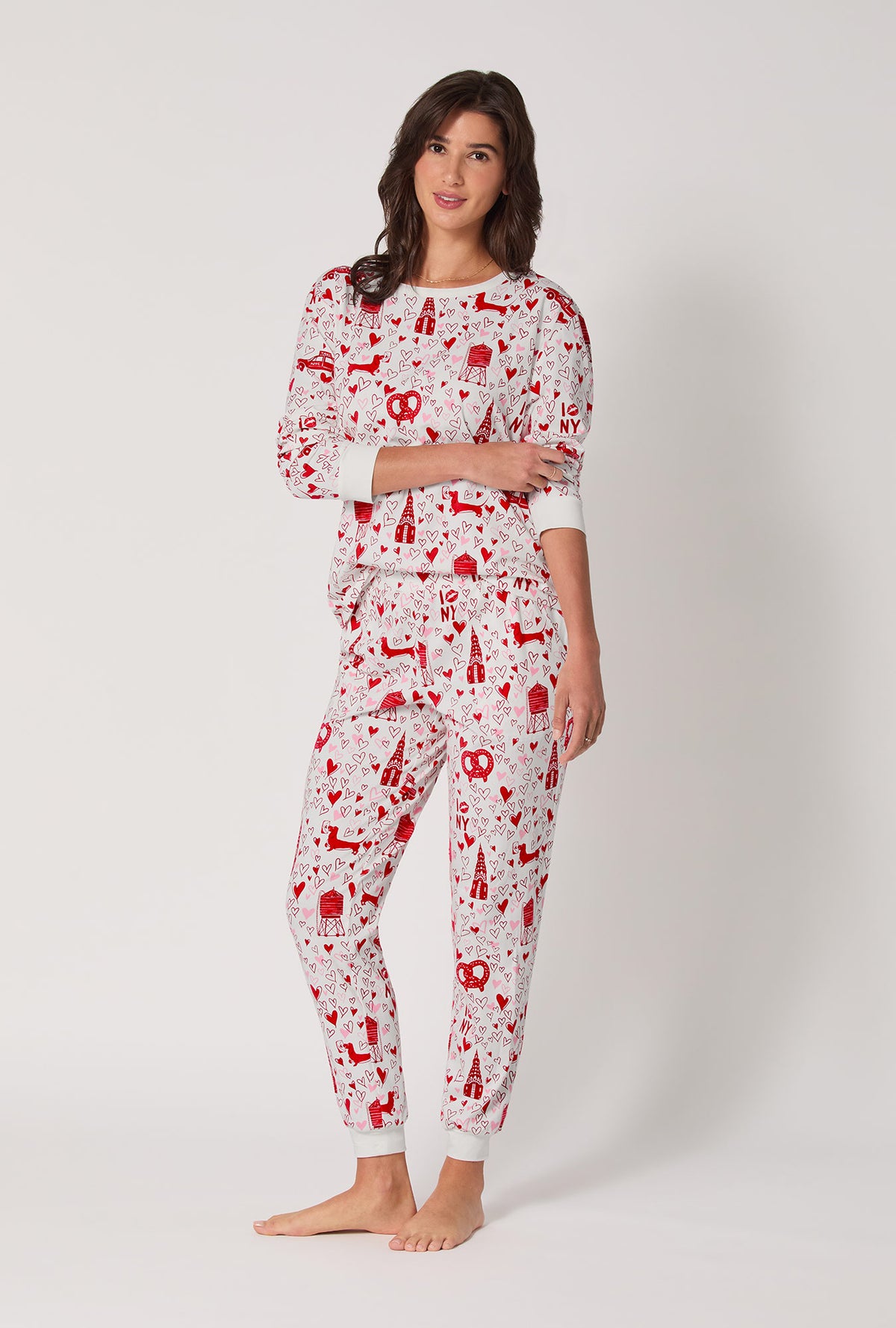 A lady wearing Heart Of The City Long Sleeve Pullover Crew And Jogger Stretch Jersey Pj Set