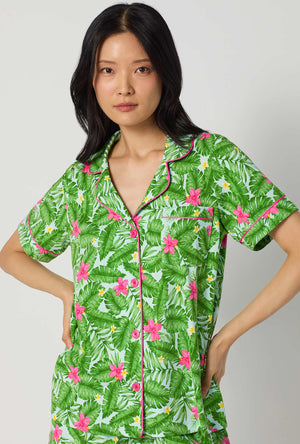 A Lady Wearing Monstera Bloom Short Sleeve Classic Shorty Stretch Jersey Pj Set Facing front in a close up view