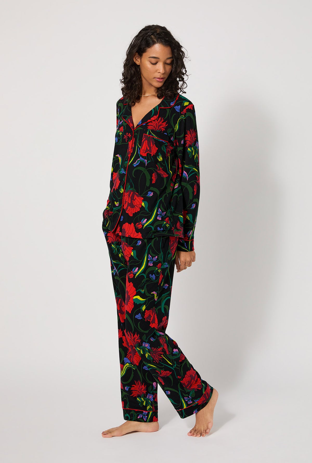 A lady wearing BedHead X Trina Turk Haute Floral Long Sleeve Classic Stretch Jersey Pj Set