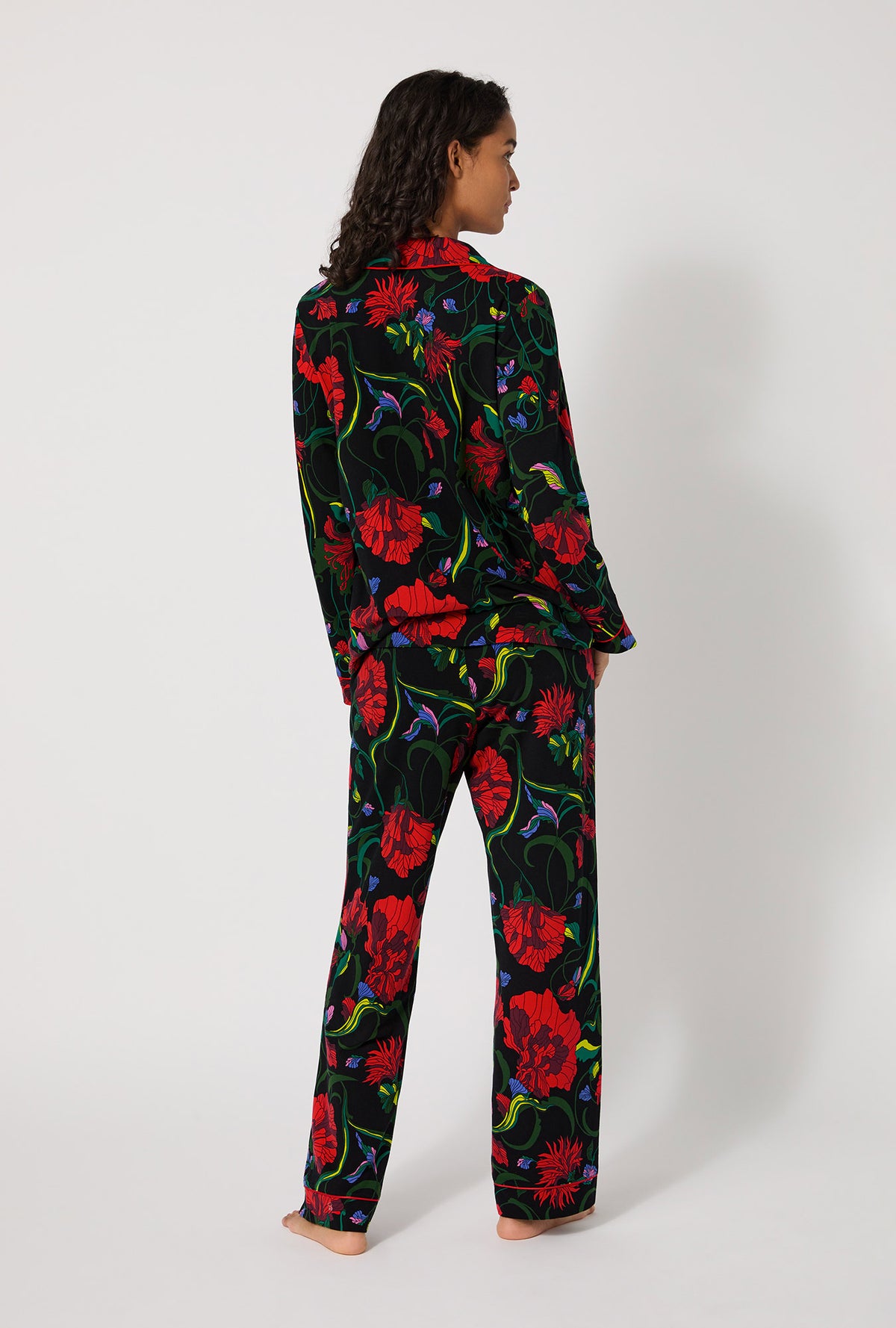 A lady wearing BedHead X Trina Turk Haute Floral Long Sleeve Classic Stretch Jersey Pj Set