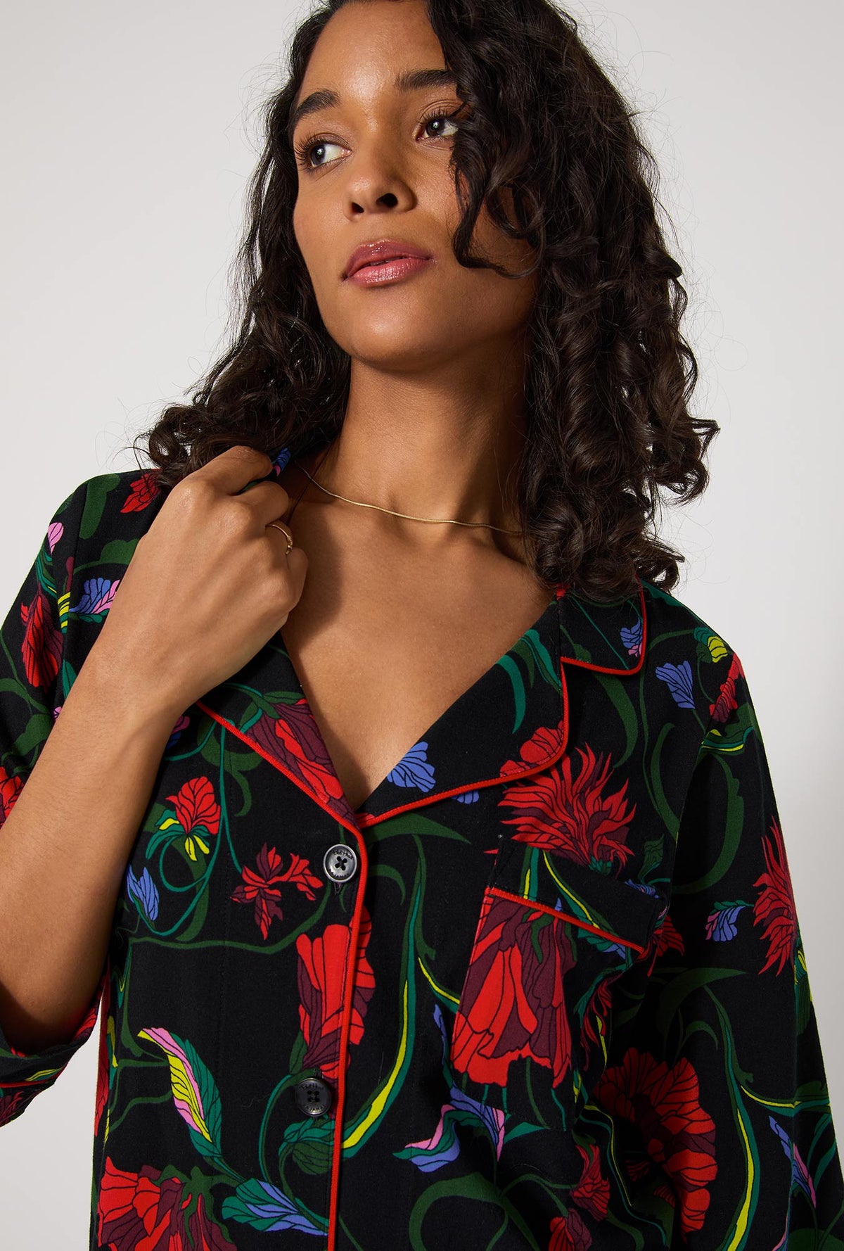A lady wearing BedHead X Trina Turk Haute Floral Long Sleeve Classic Stretch Jersey Pj Set