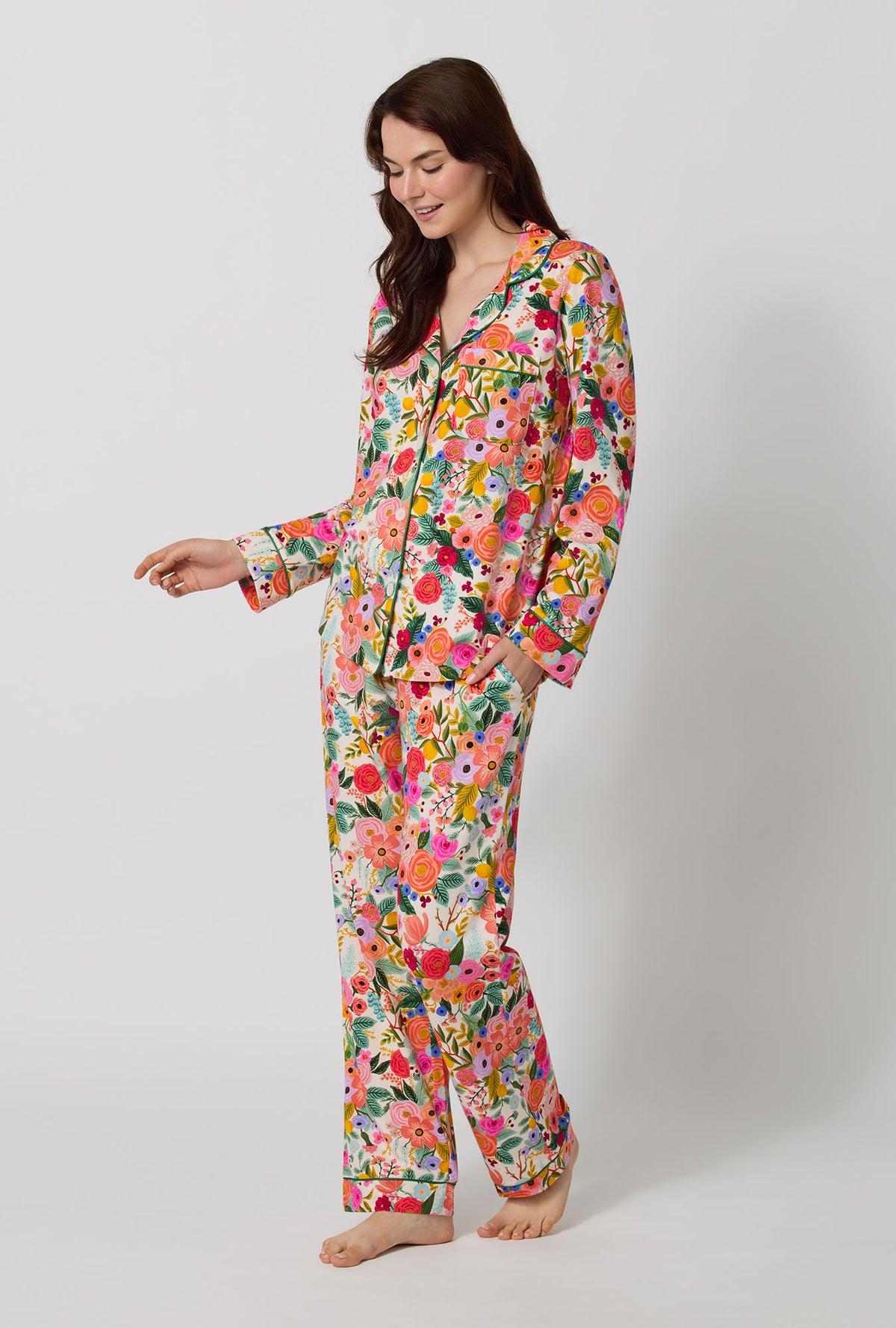 A lady wearing Rifle Paper Co. x BedHead PJs Garden Party Long Sleeve Classic Stretch Jersey Pj Set looking down