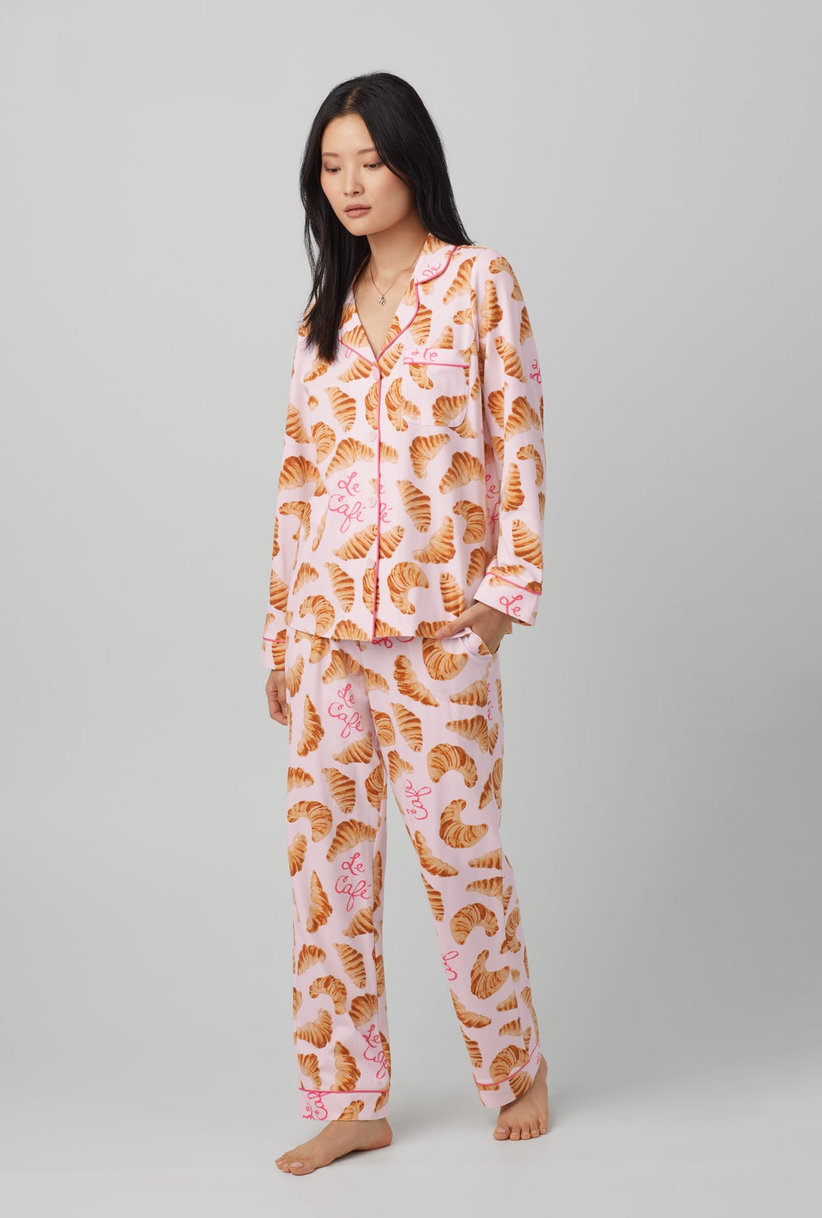 A lady wearing orange Long Sleeve Classic Stretch Jersey PJ Set with Le Cafe  print.