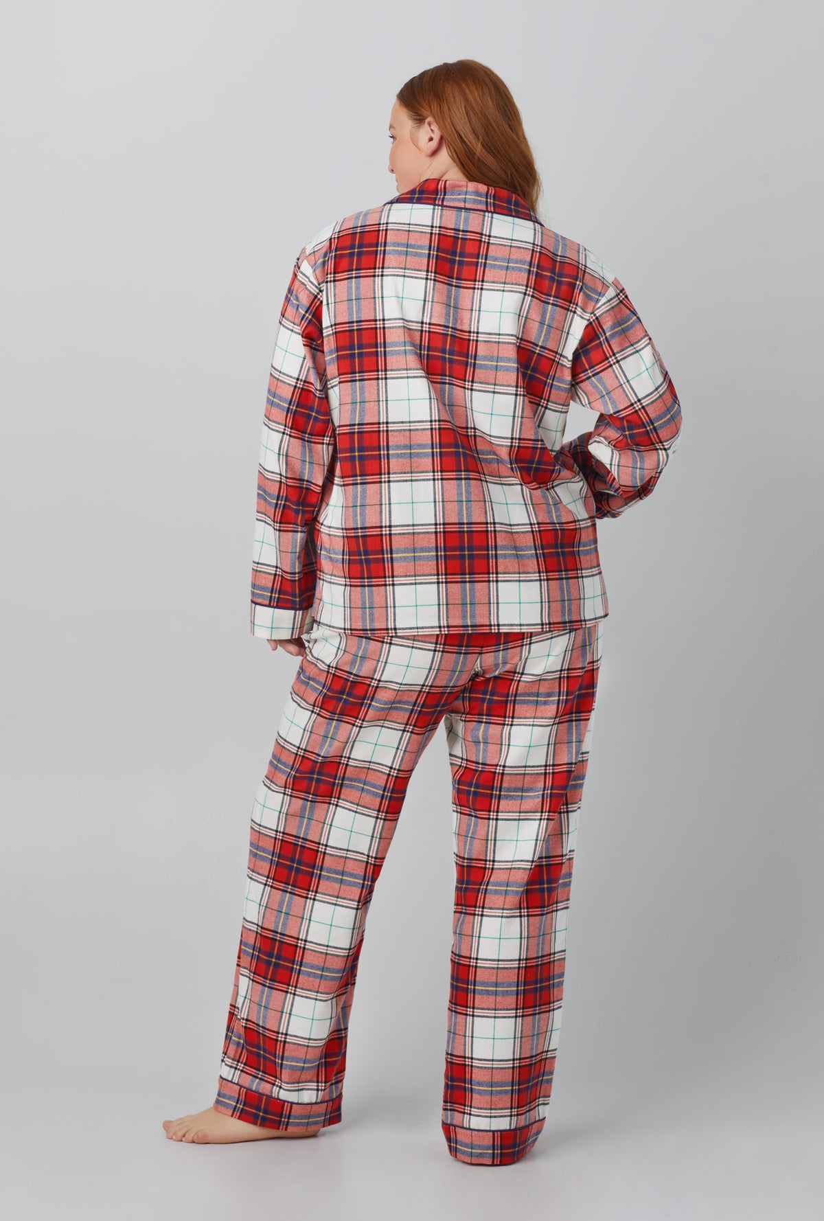 A lady wearing red Long Sleeve Classic Woven Cotton Portuguese Flannel PJ Set with Festive Tartan print