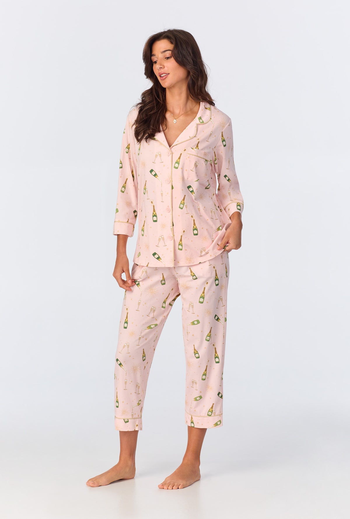 A lady wearing 3/4 Sleeve Classic Stretch Jersey Cropped PJ Set with pop fizz clink print