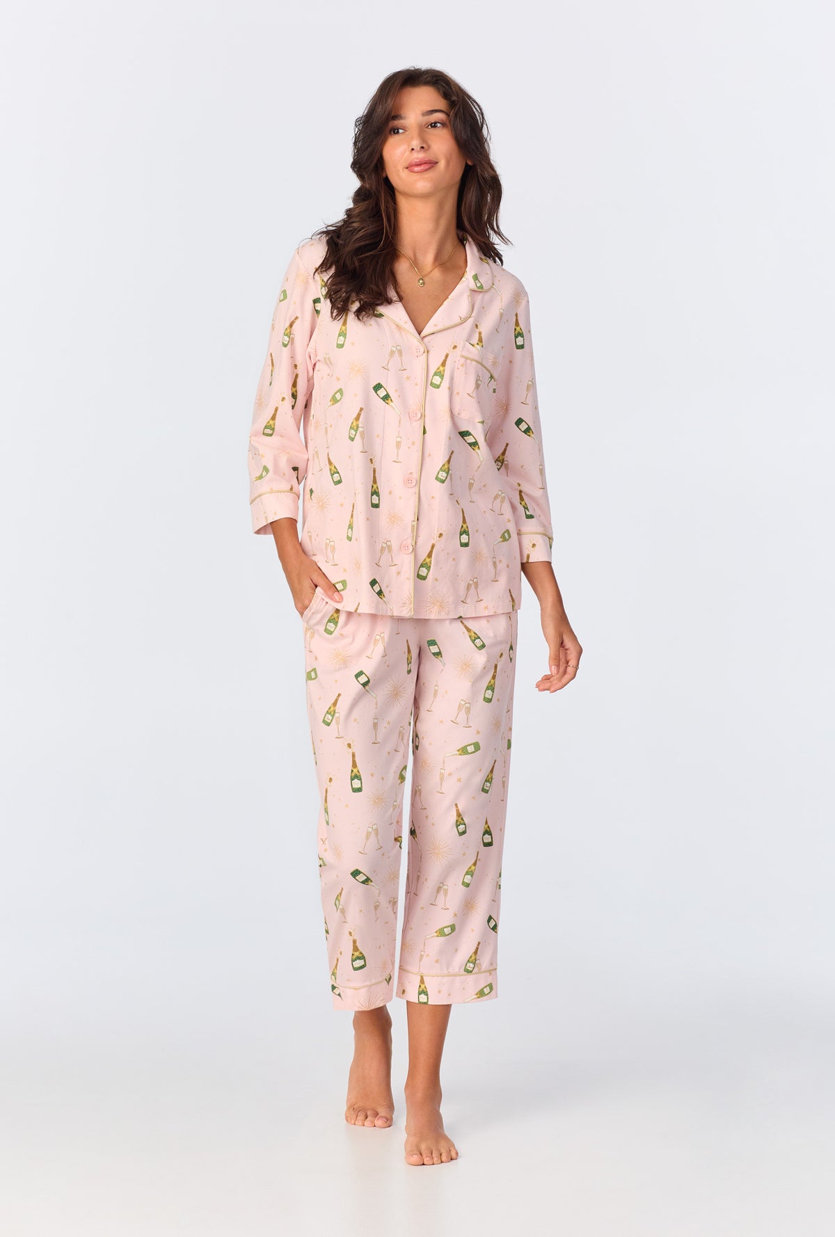 A lady wearing 3/4 Sleeve Classic Stretch Jersey Cropped PJ Set with pop fizz clink print