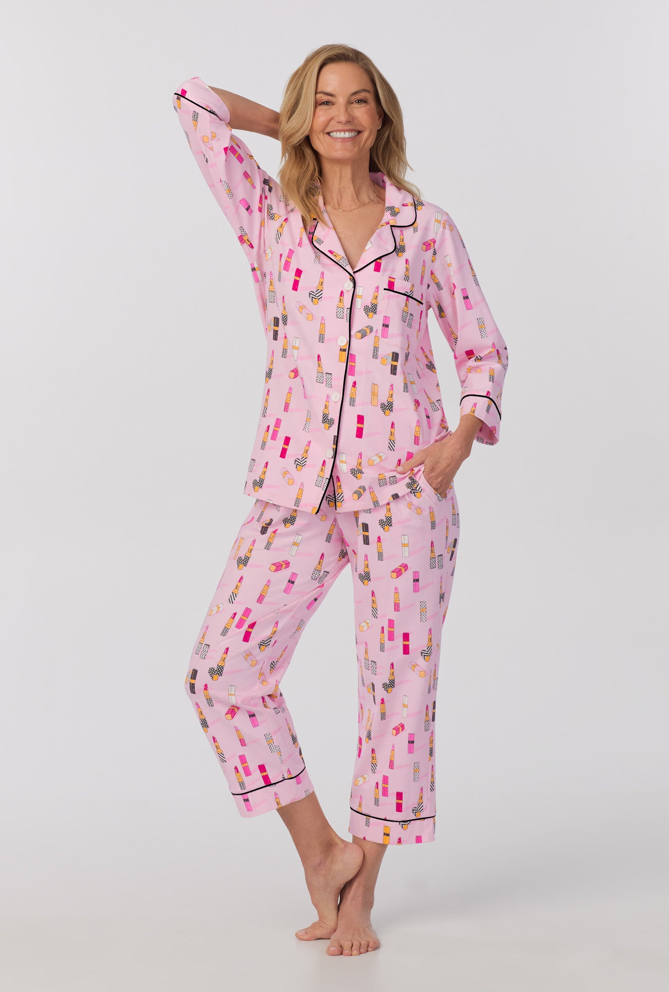 A lady wearing 3/4 Sleeve Classic Stretch Jersey Cropped PJ Set with pretty in pink print