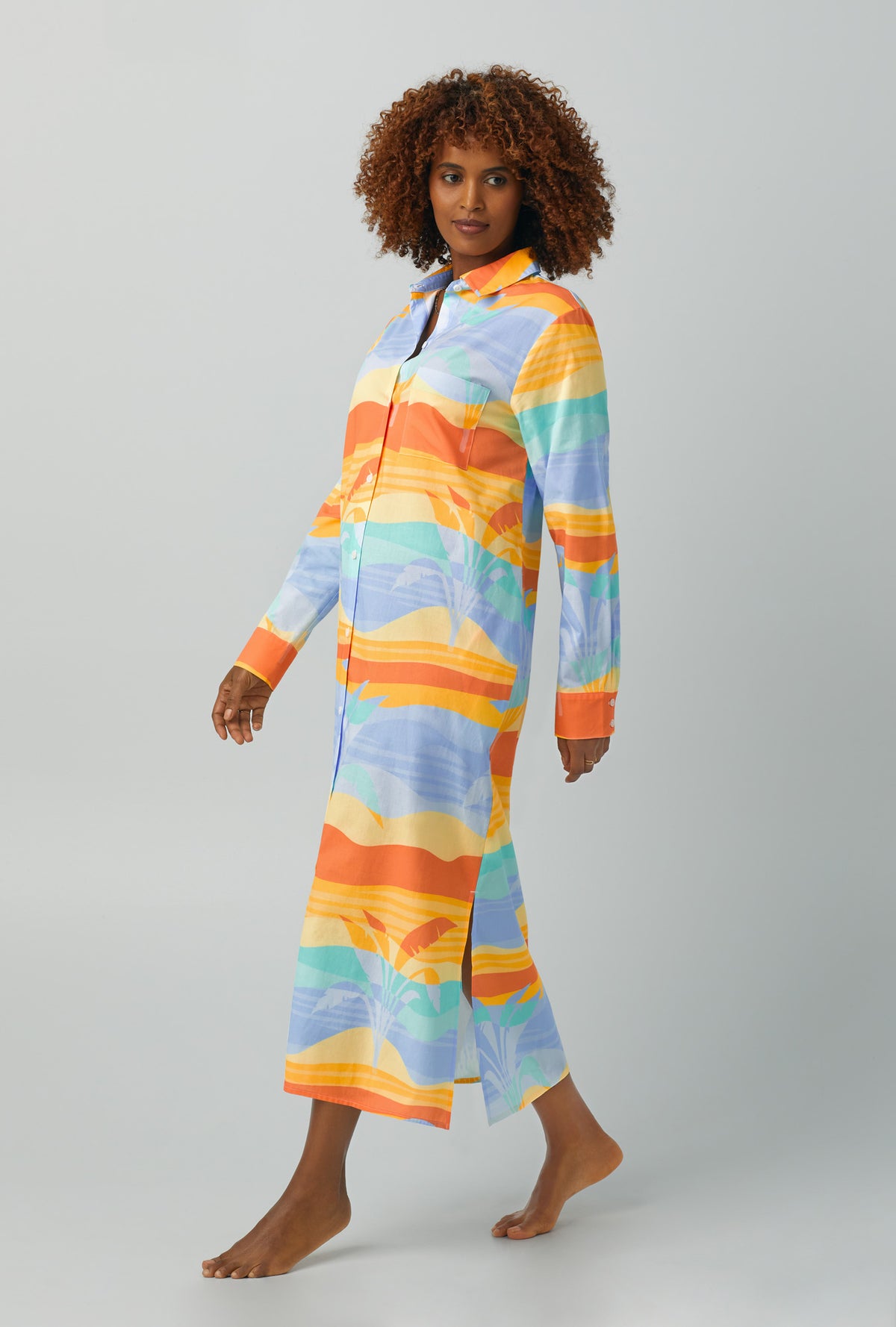 A lady wearing multi color  Long Sleeve Maxi Collared Woven Cotton Poplin Sleepshirt with Desert Palms print