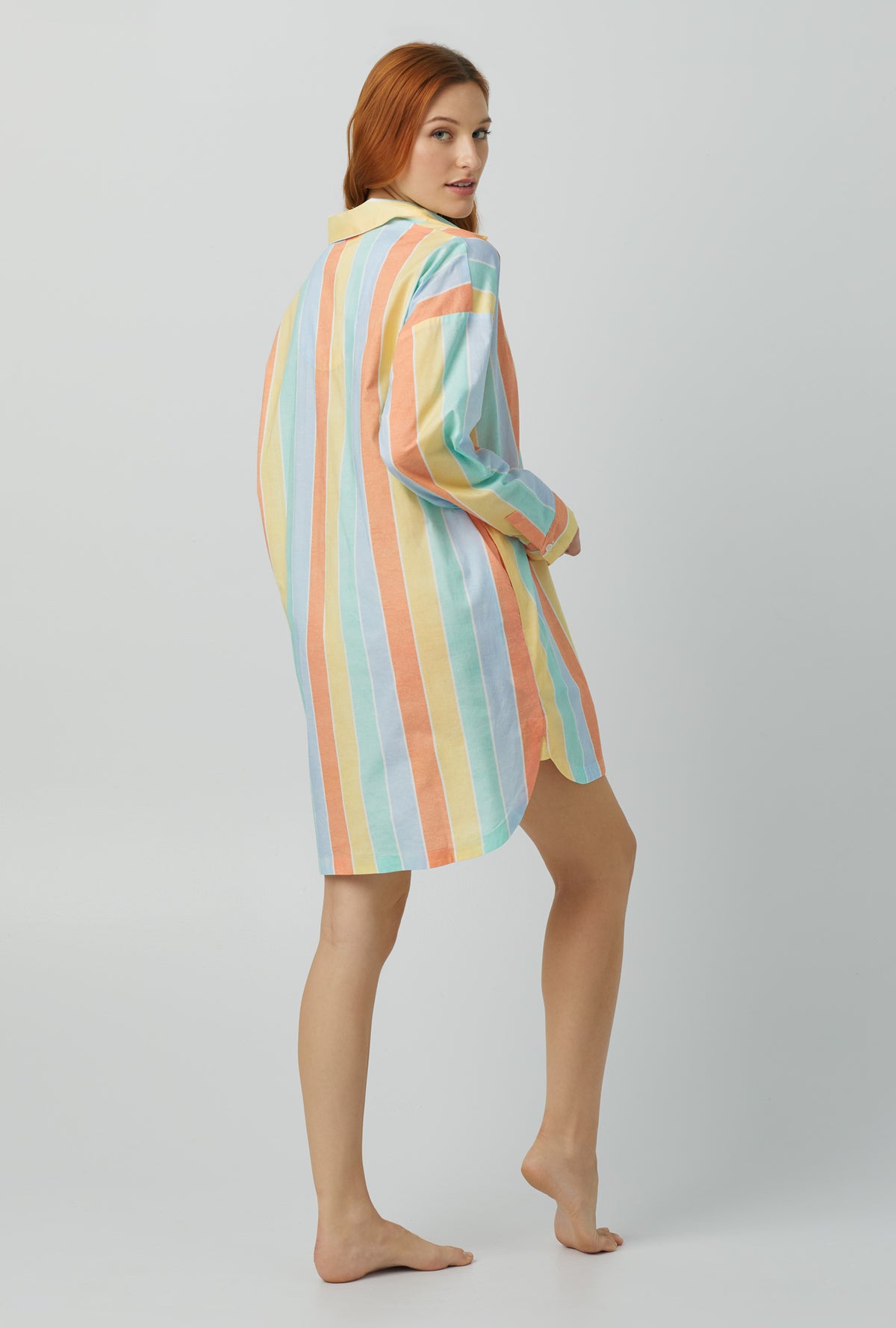 A lady wearing multi color Woven Cotton Poplin Boyfriend Shirt with Sunset Stripe print