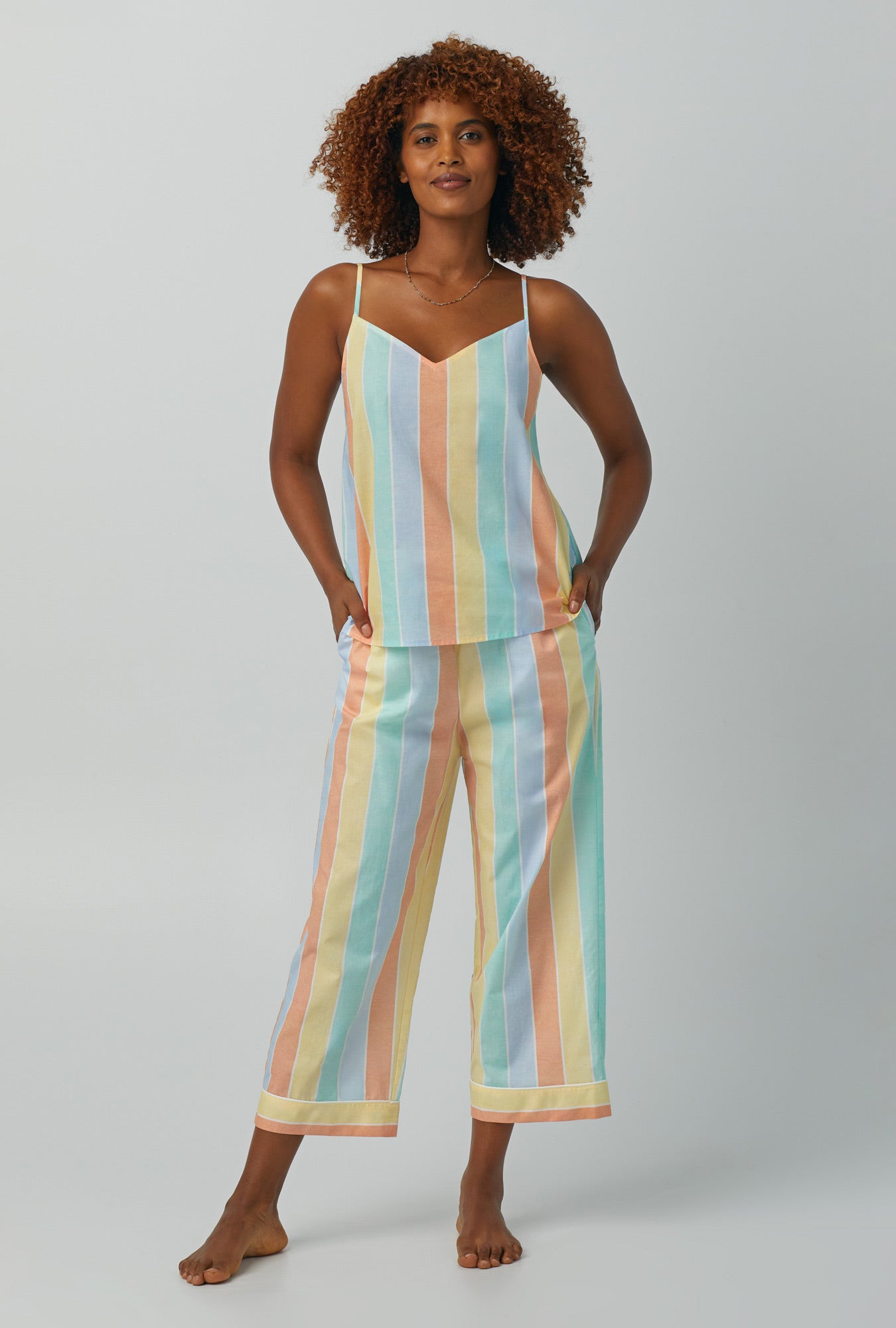 A lady wearing multi color Tank Woven Cotton Poplin Cropped PJ Set with Sunset Stripe print