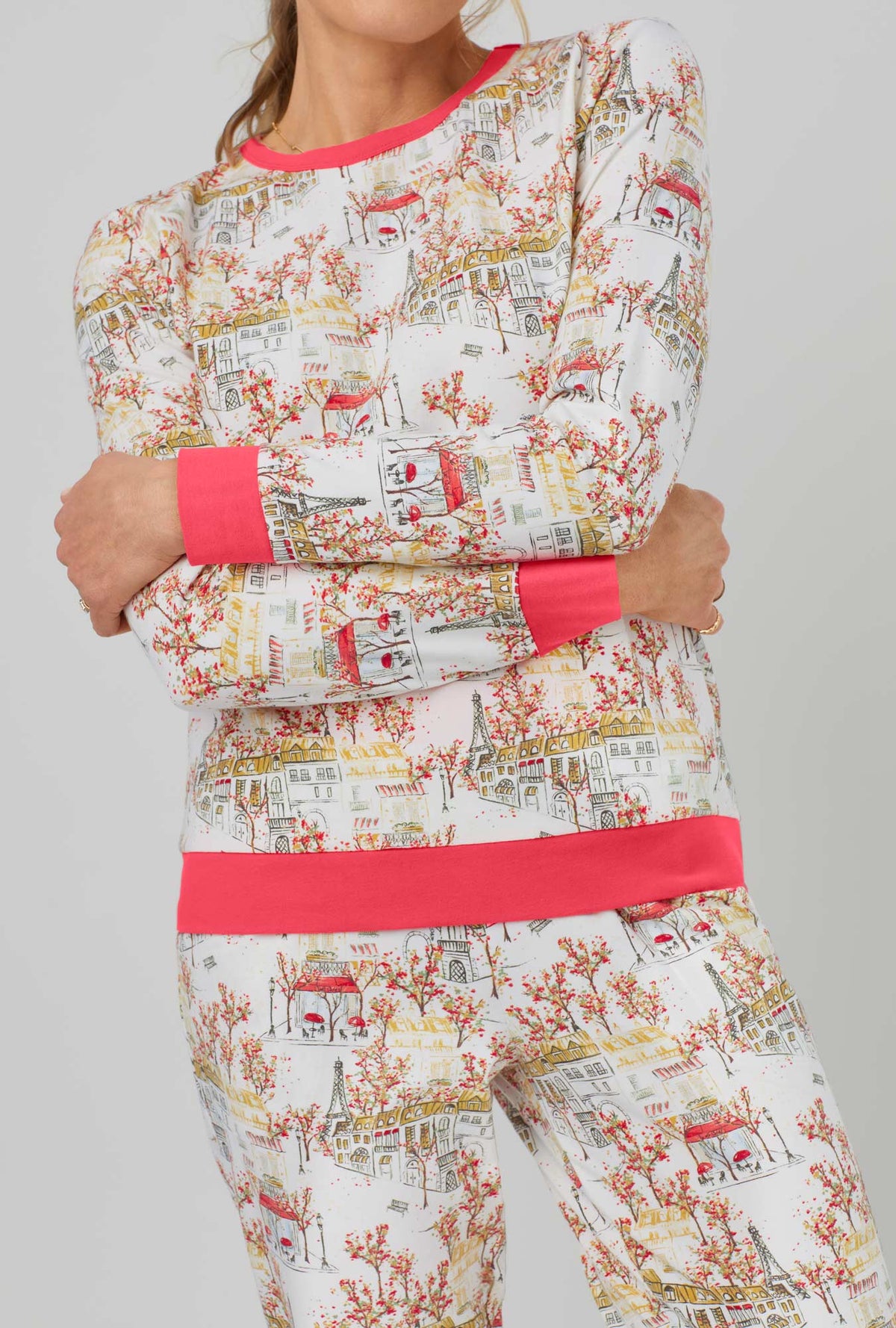 A lady wearing Long Sleeve Pullover Crew and Jogger Stretch Jersey PJ Set with fall in paris print.