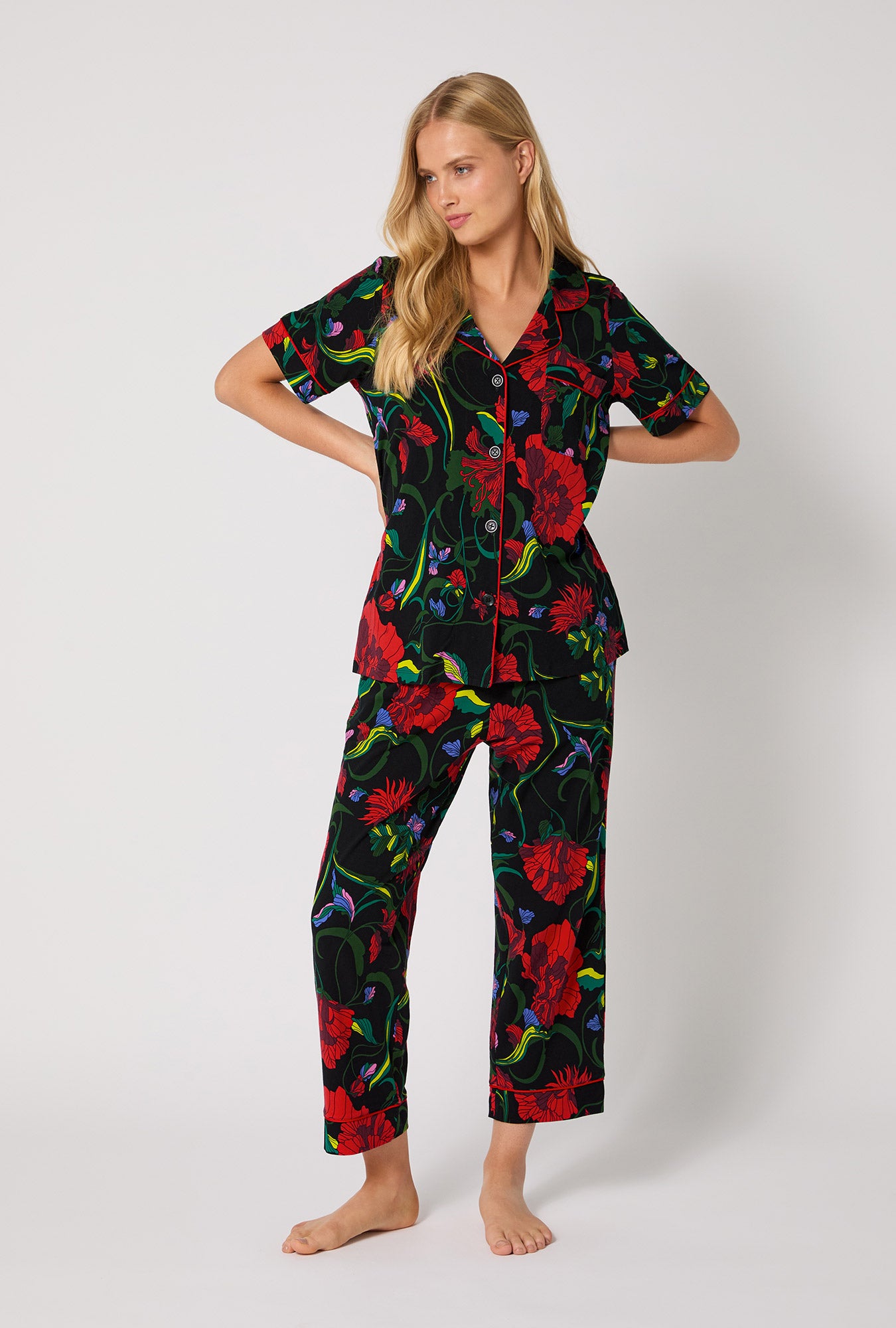 A lady wearing BedHead X Trina Turk Haute Floral Short Sleeve Classic Stretch Jersey Cropped Pj Set