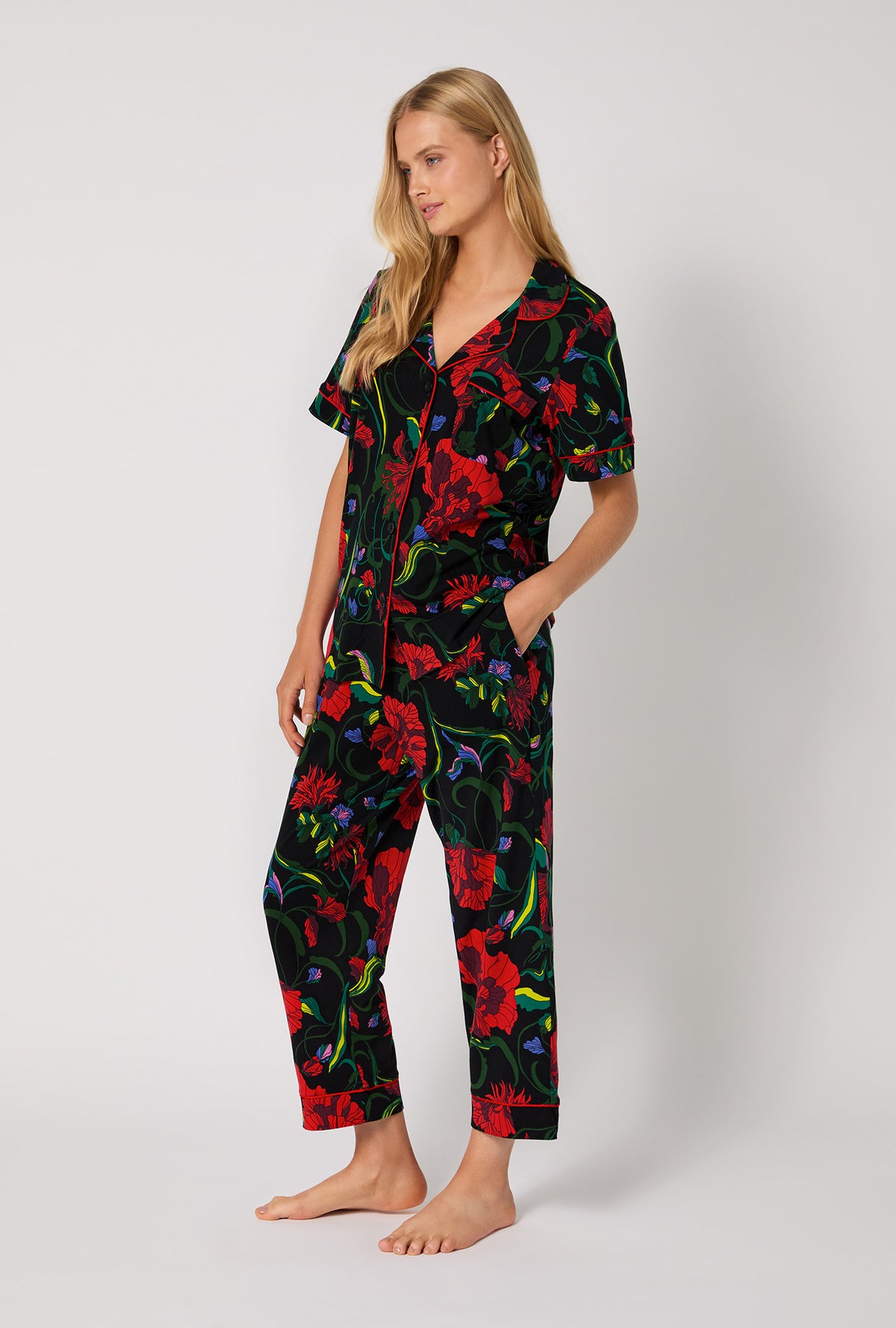 A lady wearing BedHead X Trina Turk Haute Floral Short Sleeve Classic Stretch Jersey Cropped Pj Set