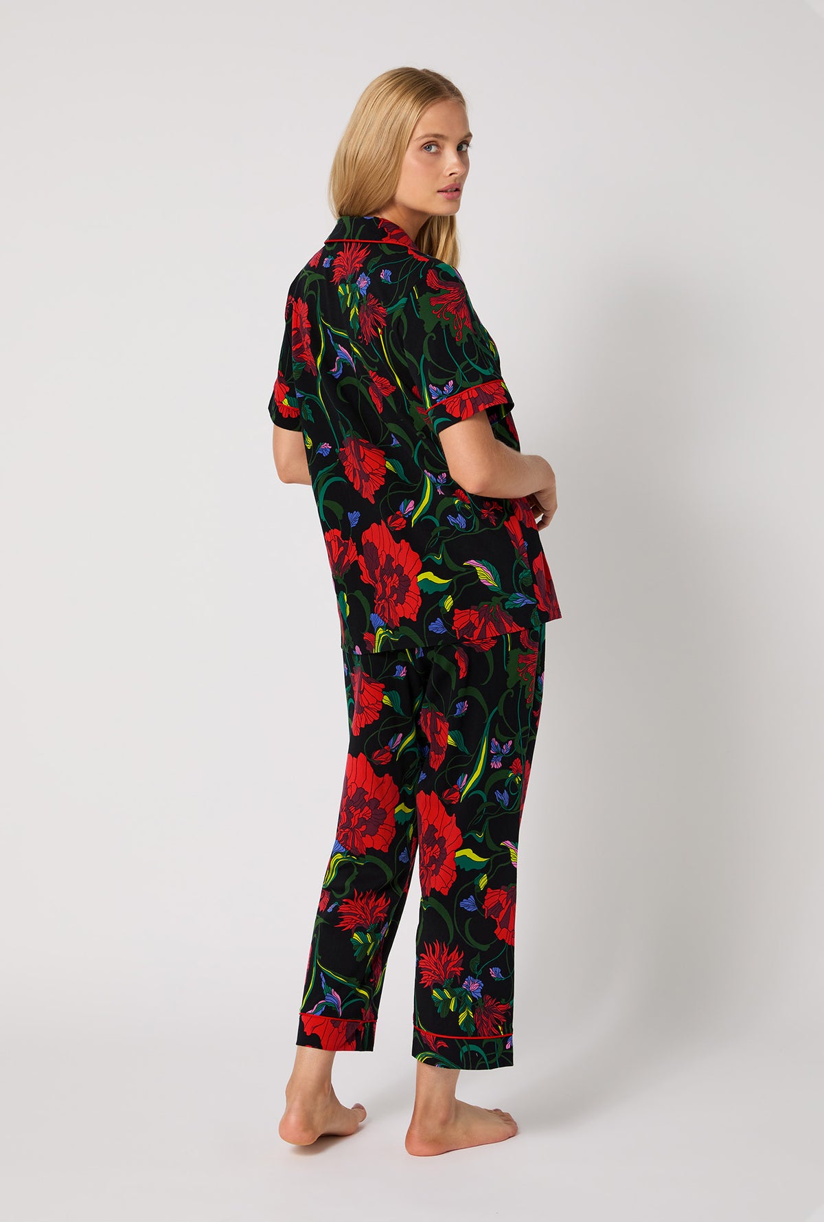 A lady wearing BedHead X Trina Turk Haute Floral Short Sleeve Classic Stretch Jersey Cropped Pj Set
