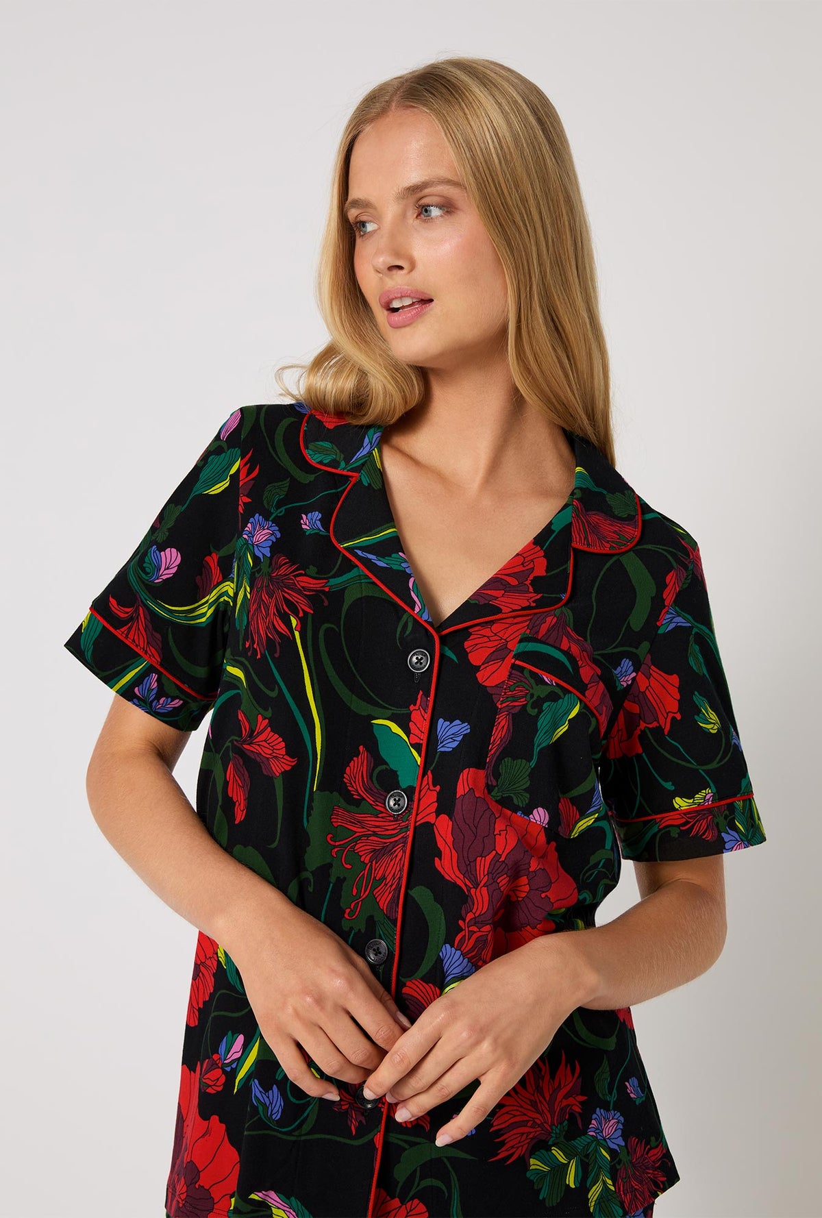 A lady wearing BedHead X Trina Turk Haute Floral Short Sleeve Classic Stretch Jersey Cropped Pj Set