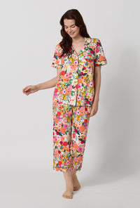 A lady wearing Rifle Paper Co. x BedHead PJs Garden Party Short Sleeve Classic Stretch Jersey Cropped Pj Set looking down