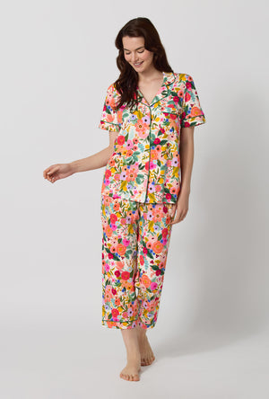 A lady wearing Rifle Paper Co. x BedHead PJs Garden Party Short Sleeve Classic Stretch Jersey Cropped Pj Set looking down