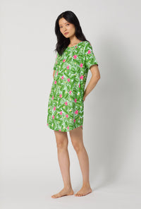 A Lady Wearing Monstera Bloom Stretch Jersey T-shirt Sleep Dress posing in a side angle look