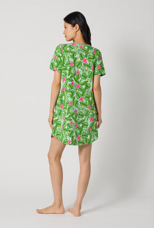 A Lady Wearing Monstera Bloom Stretch Jersey T-shirt Sleep Dress showing the back view of the dress