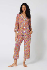 A lady wearing Ditsy Harvest 3/4 Sleeve Classic Stretch Jersey Cropped Pj Set