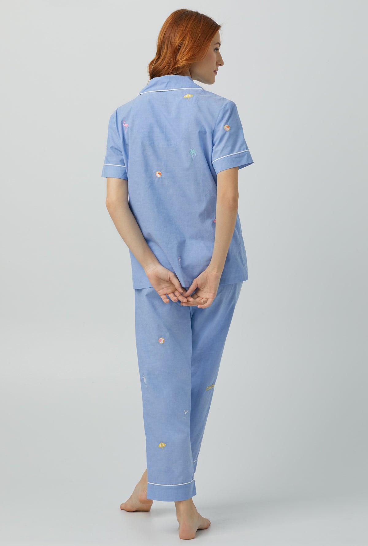 A lady wearing blue Short Sleeve Classic Woven Cotton Poplin Cropped PJ Set with Chambray print