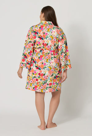 A lady wearing plus size Rifle Paper Co. x BedHead PJs Garden Party Banded Collar Stretch Jersey Robe back view