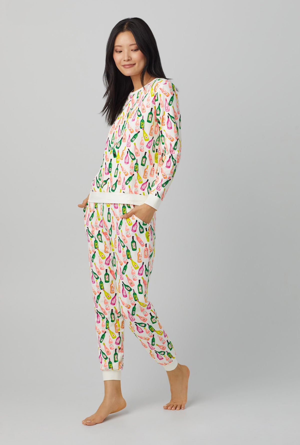 A lady wearing Long Sleeve Pullover Crew and Jogger Stretch Jersey PJ Set with Wine List print
