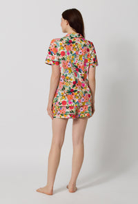 A lady wearing Rifle Paper Co. x BedHead PJs Garden Party Short Sleeve Classic Shorty Stretch Jersey Pj Set back view