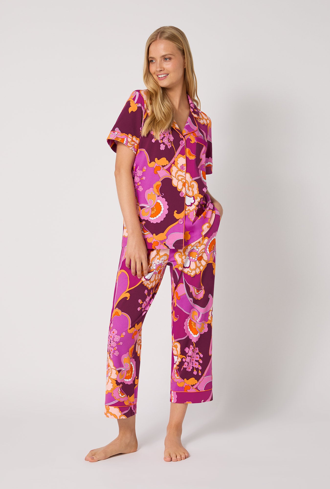 A lady wearing BedHead X Trina Turk Apache Plume Short Sleeve Classic Stretch Jersey Cropped Pj Set