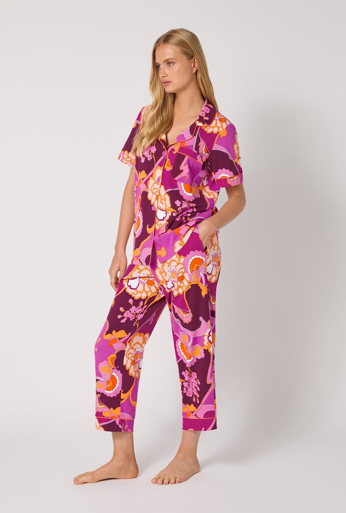 A lady wearing BedHead X Trina Turk Apache Plume Short Sleeve Classic Stretch Jersey Cropped Pj Set