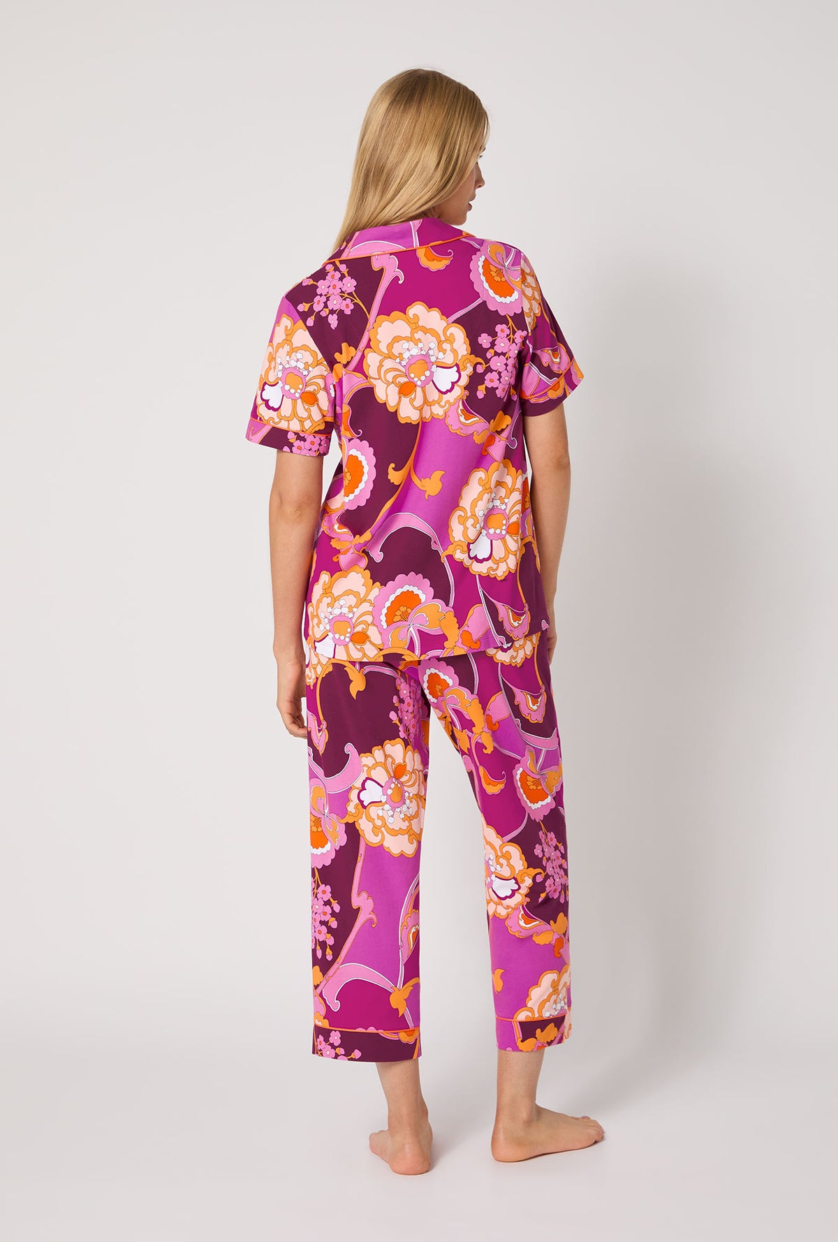 A lady wearing BedHead X Trina Turk Apache Plume Short Sleeve Classic Stretch Jersey Cropped Pj Set