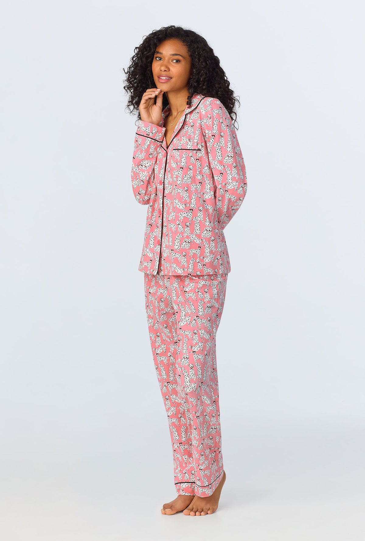 A lady wearing pink long sleeve pajama set with love spot print.