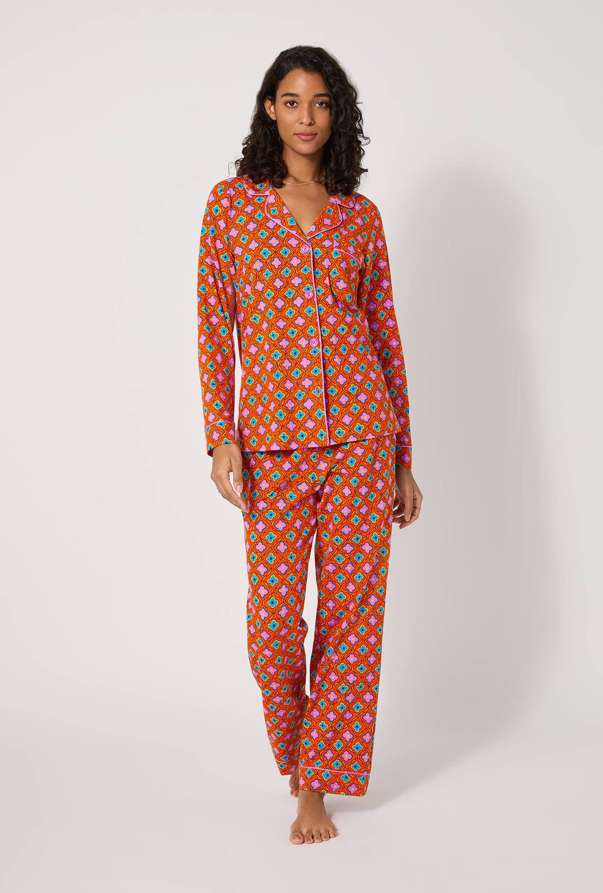 A lady wearing BedHead x Trina Turk Daisy Foulard Long Sleeve Classic Stretch Jersey Pj Set