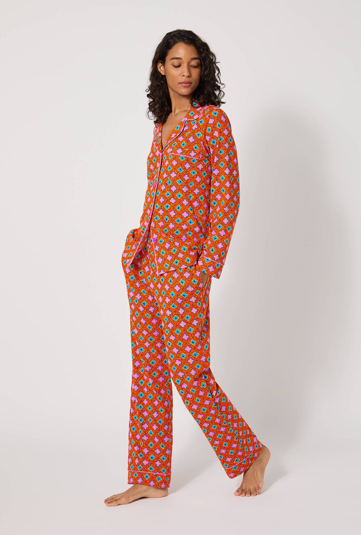 A lady wearing BedHead x Trina Turk Daisy Foulard Long Sleeve Classic Stretch Jersey Pj Set